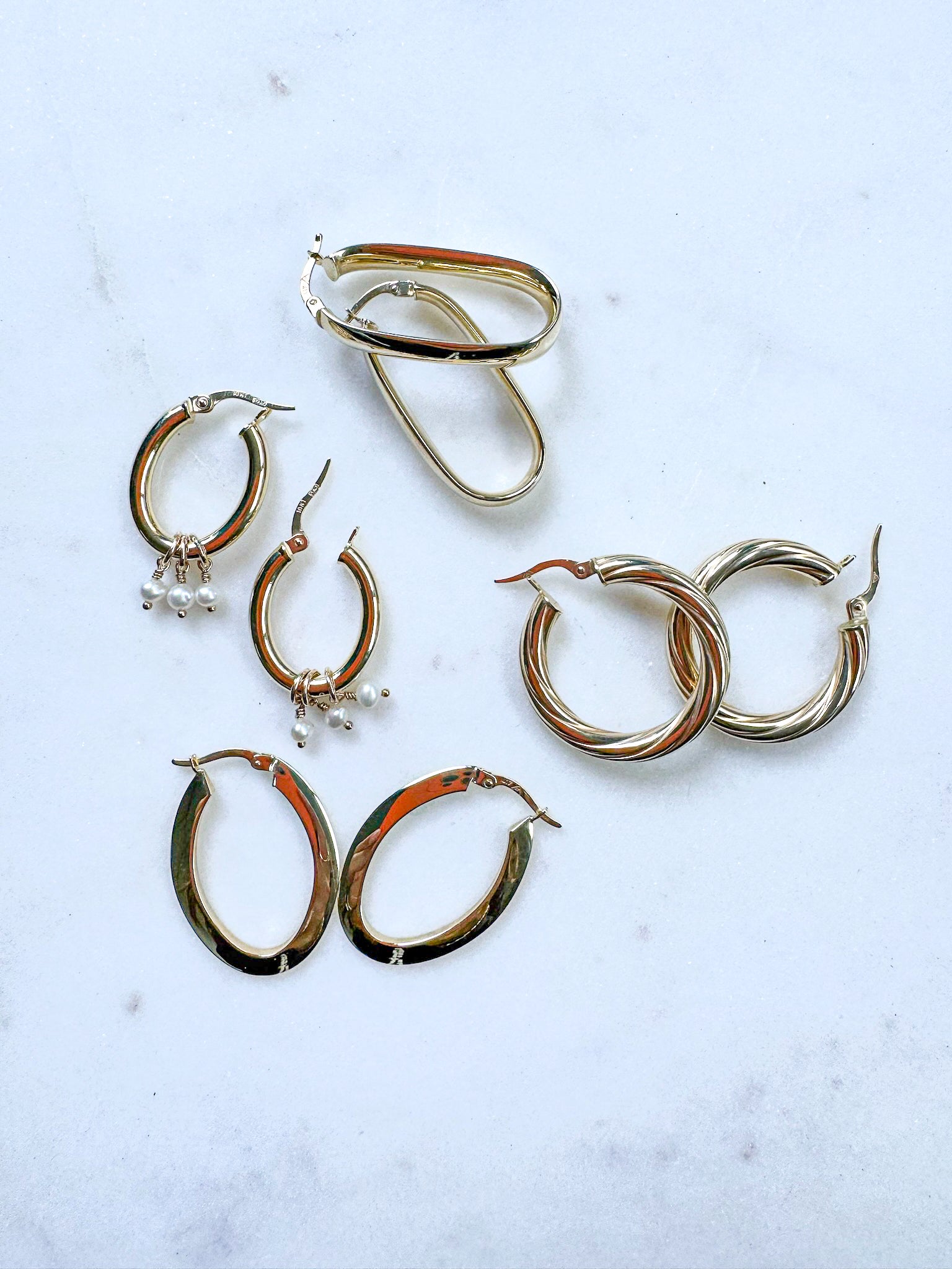 10kt Elongated Queen Hoops