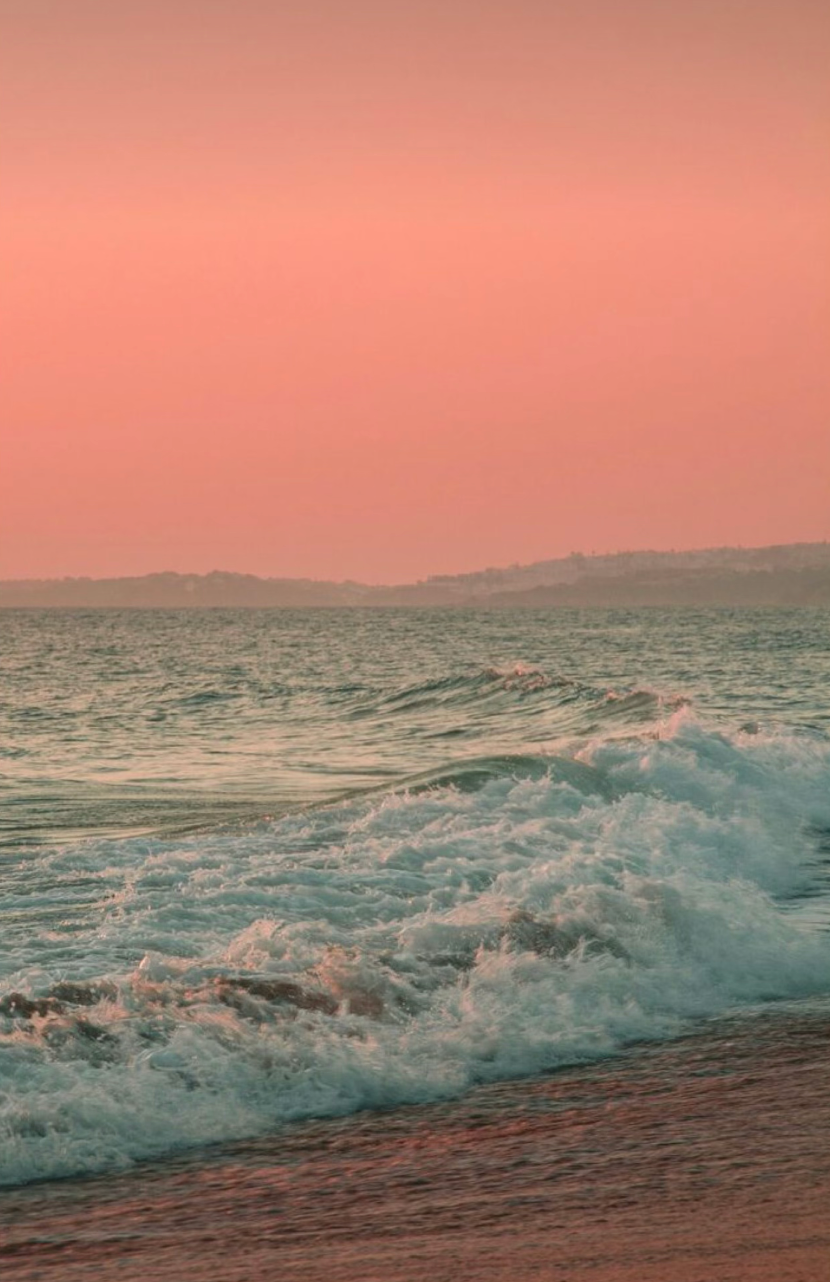 Beautiful sunset beach shot with pink sky